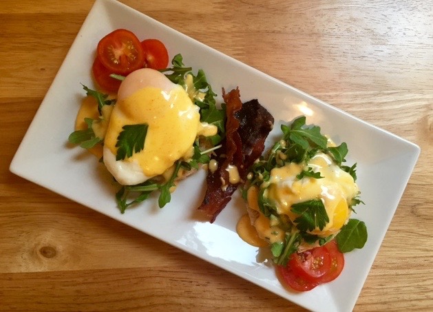 a plate of food on a wooden table