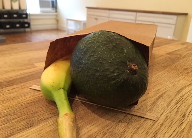 an apple sitting on top of a wooden cutting board