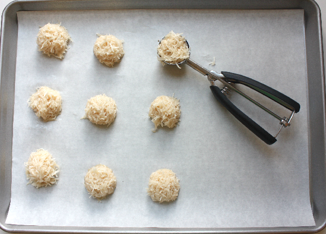 scoop the macaroon mix onto parchment paper