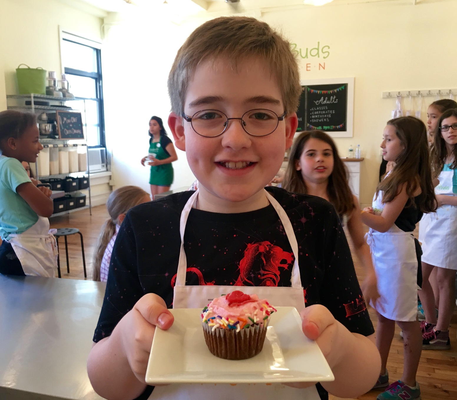 Chef-of-the-Month a person holding a birthday cake