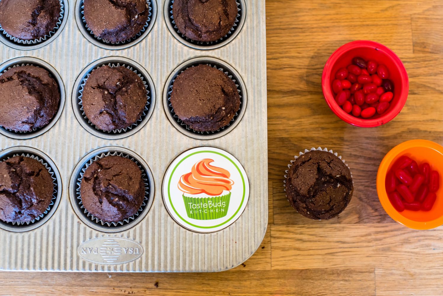 baked chocolate cupcakes unfrosted in the tin