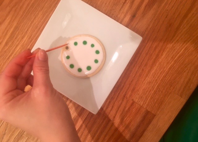 a hand holding a cell phone