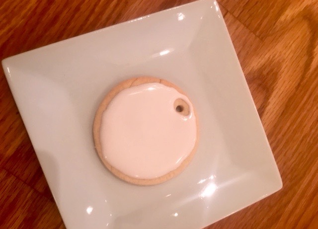 a close up of a plate on a wooden table