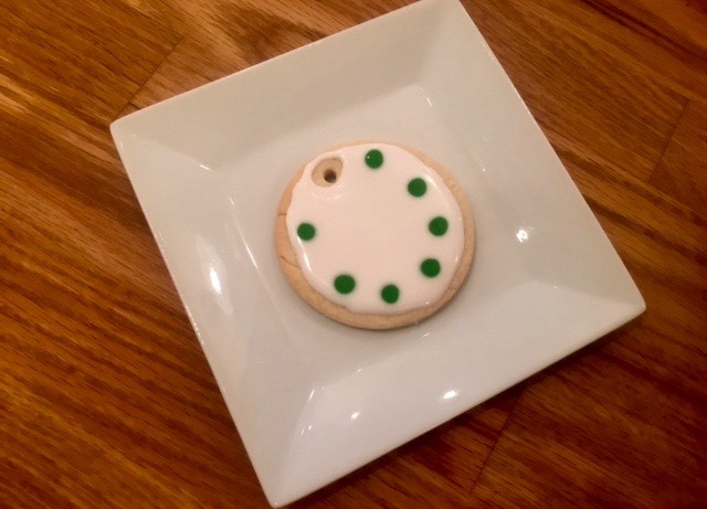 a doughnut sitting on top of a wooden table