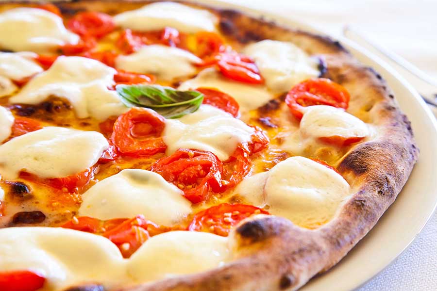 Incredible-Handmade-Pizza-event_600 a slice of pizza on a plate