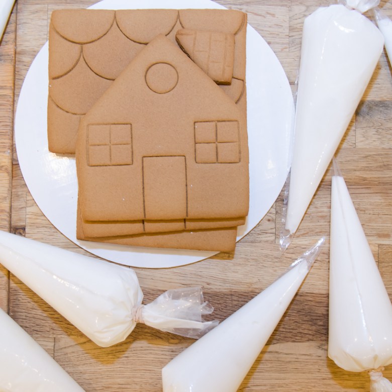 a knife on a cutting board with a cake