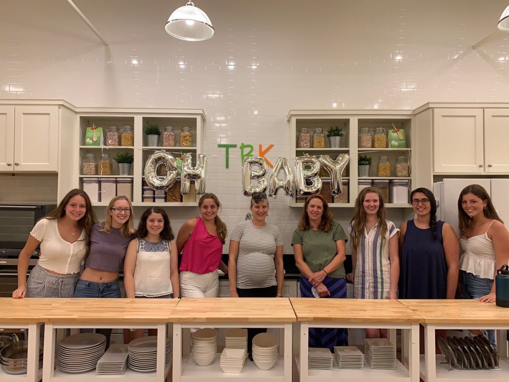 Kayla Kniep et al. sitting on a bench posing for the camera