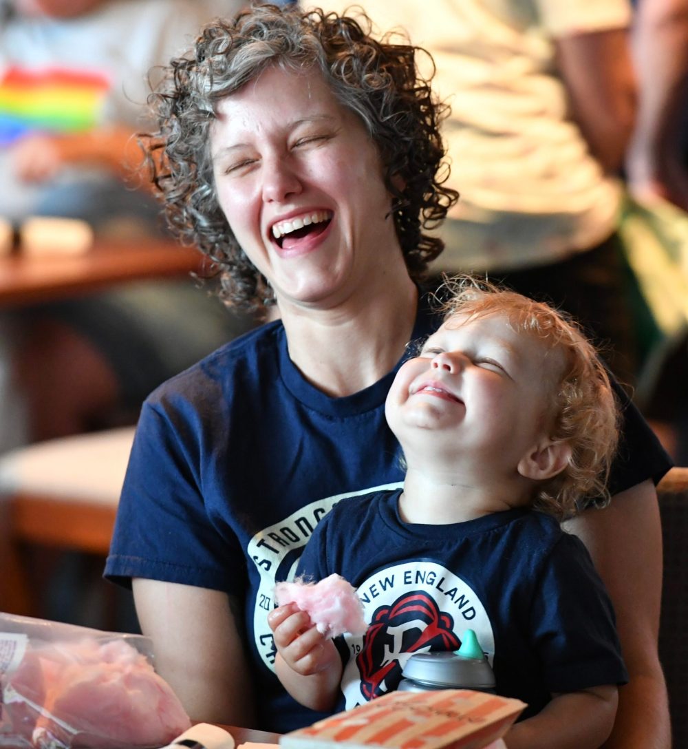 a boy and a girl sitting on a table