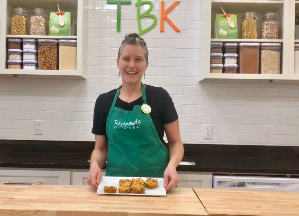 a woman standing in front of a shelf