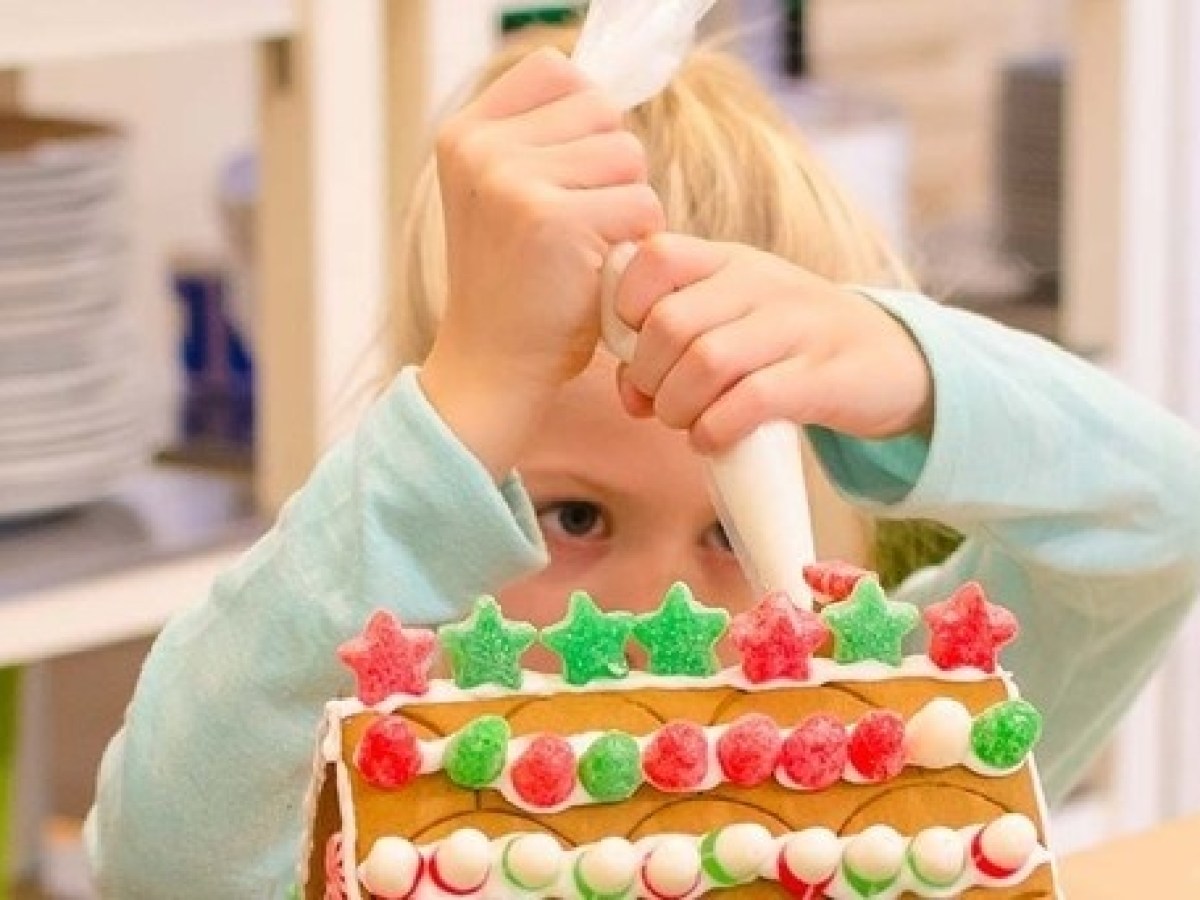 a person holding a birthday cake