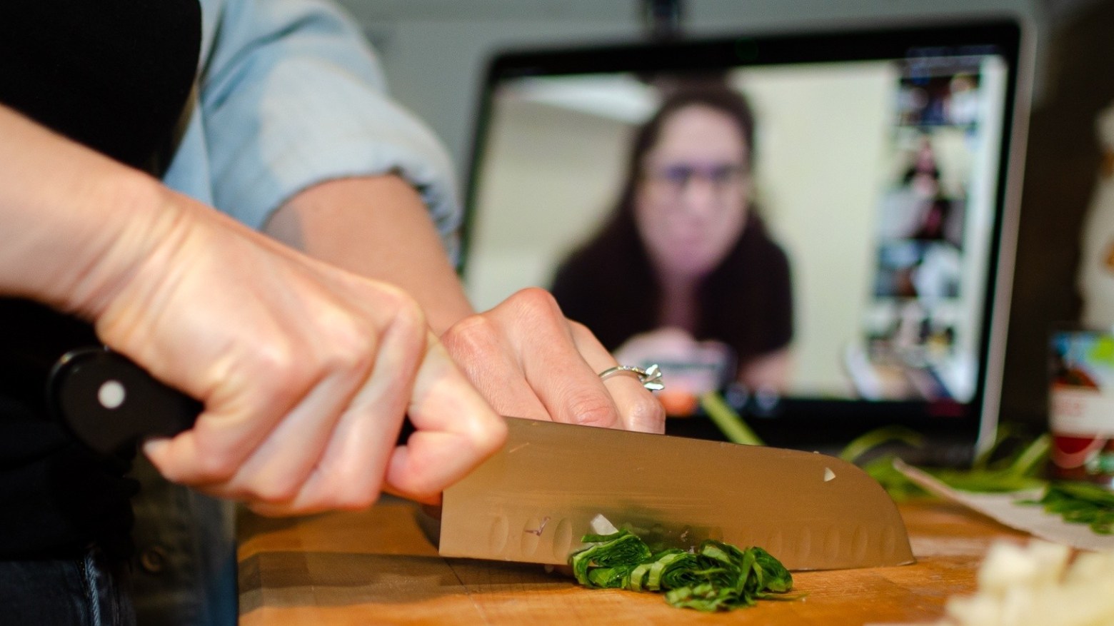 a person cutting a piece of food on a table