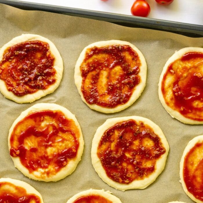 a pepperoni pizza sitting on top of a wooden table