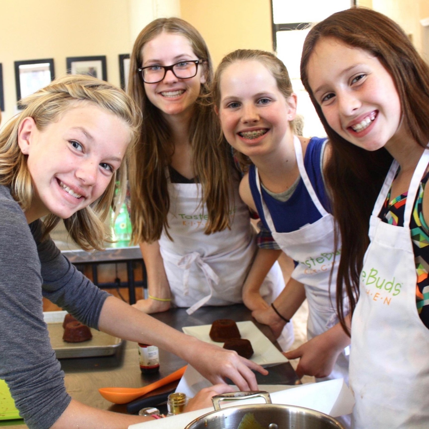 Private, 2hr Teen a group of girls smiling while making dessert