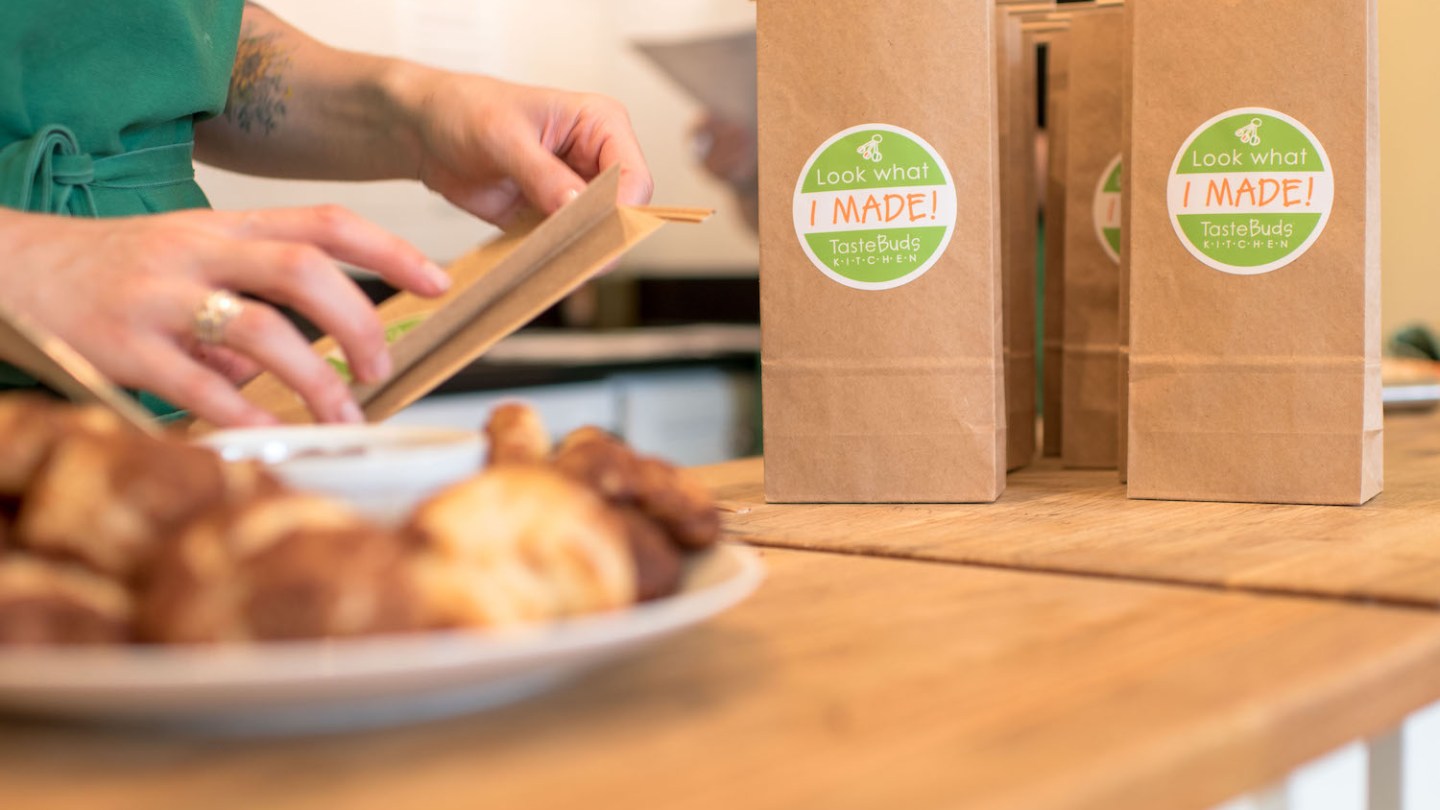 a person sitting at a table with food