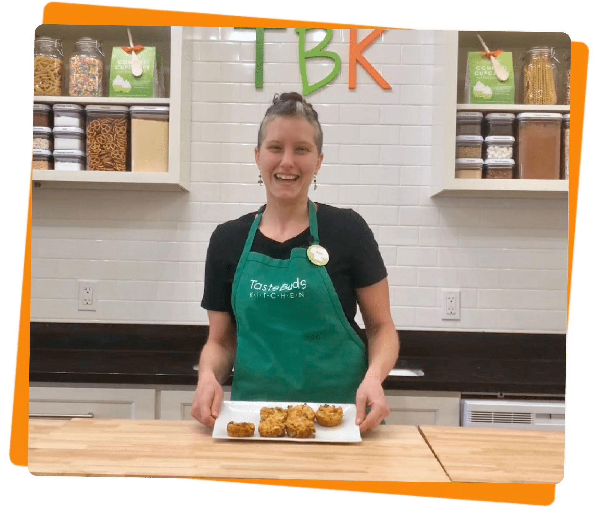 women with baked items in a kitchen