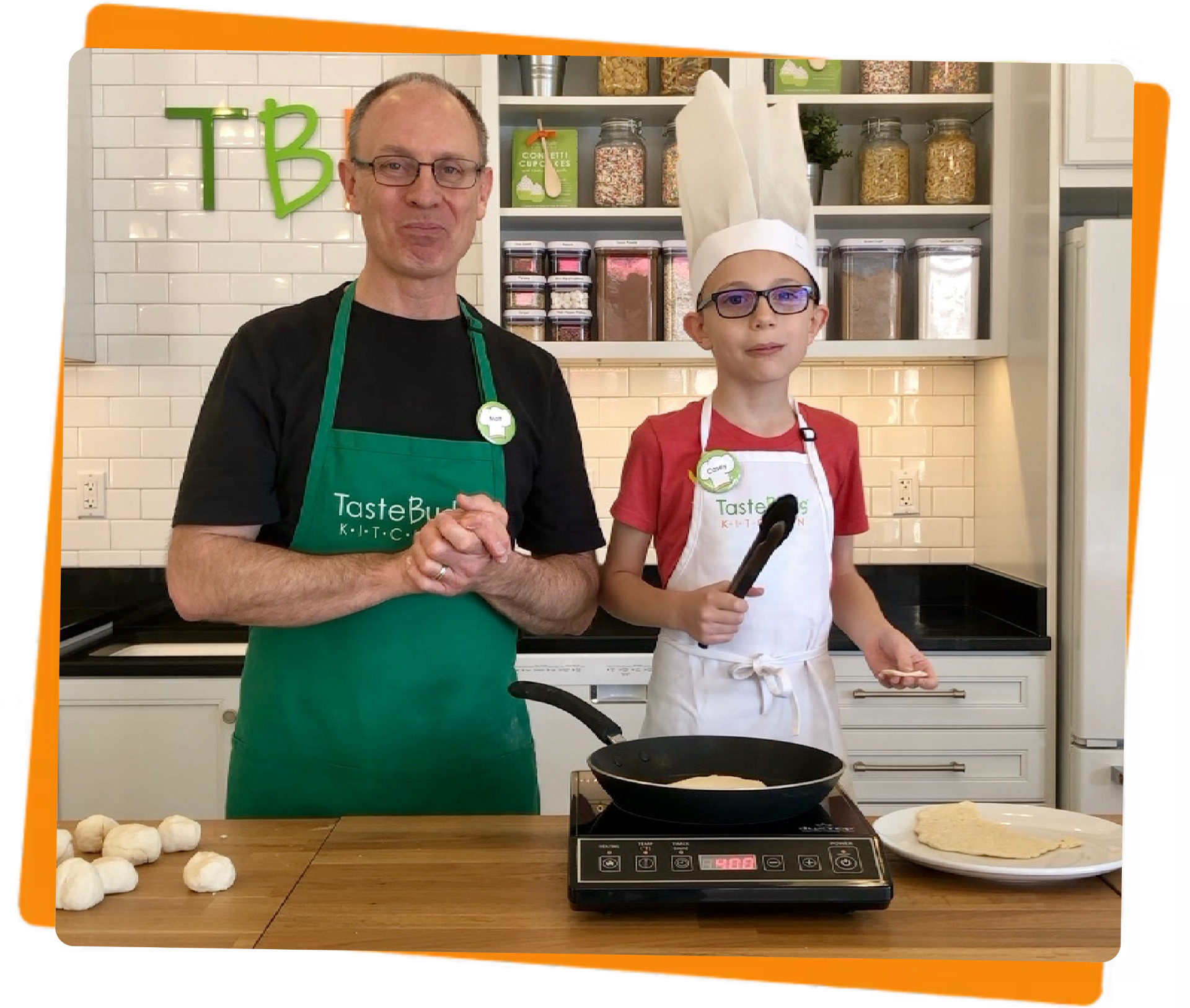 Adult and kid chef making crepes