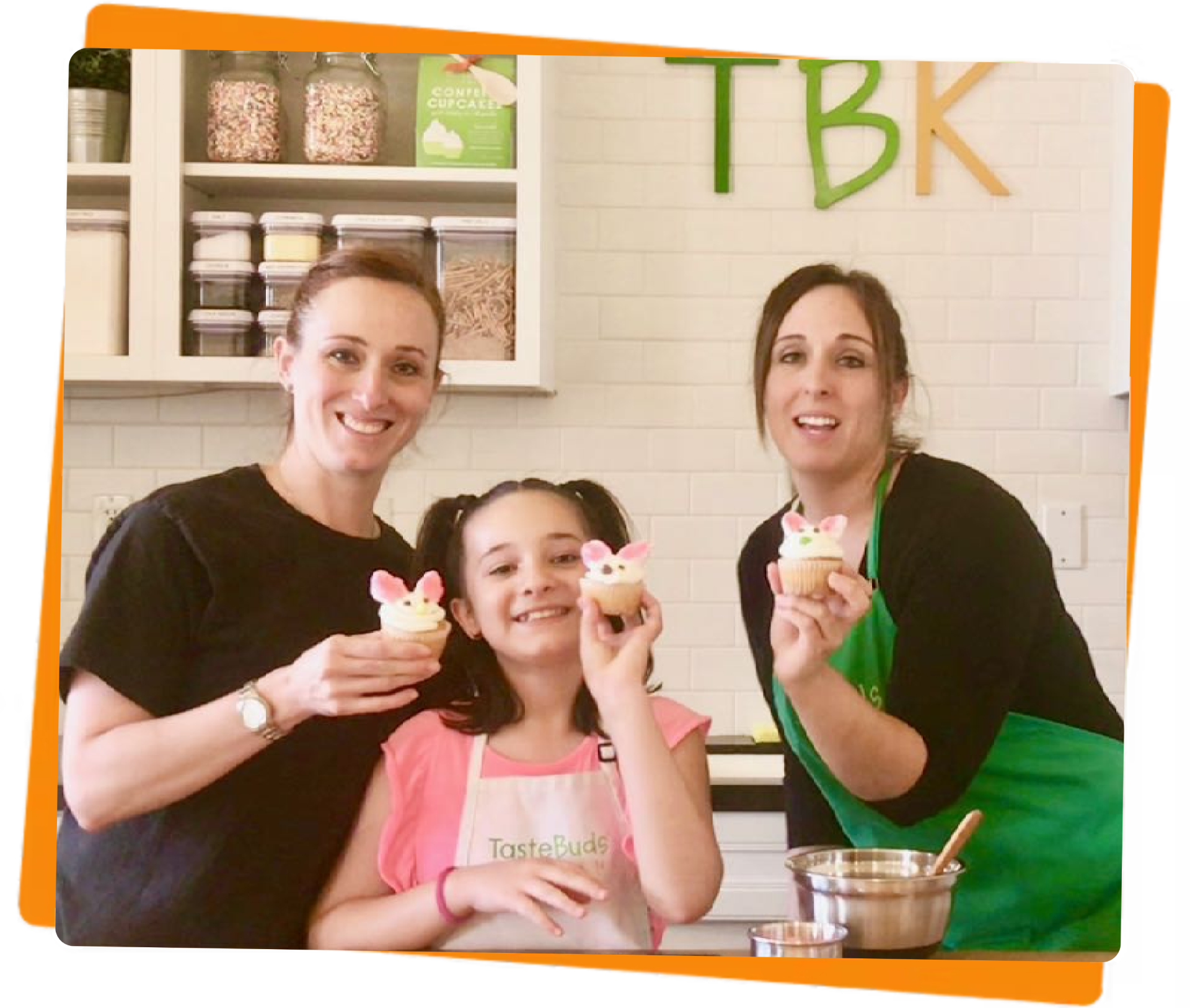 Two women and a girl with bunny cupcakes
