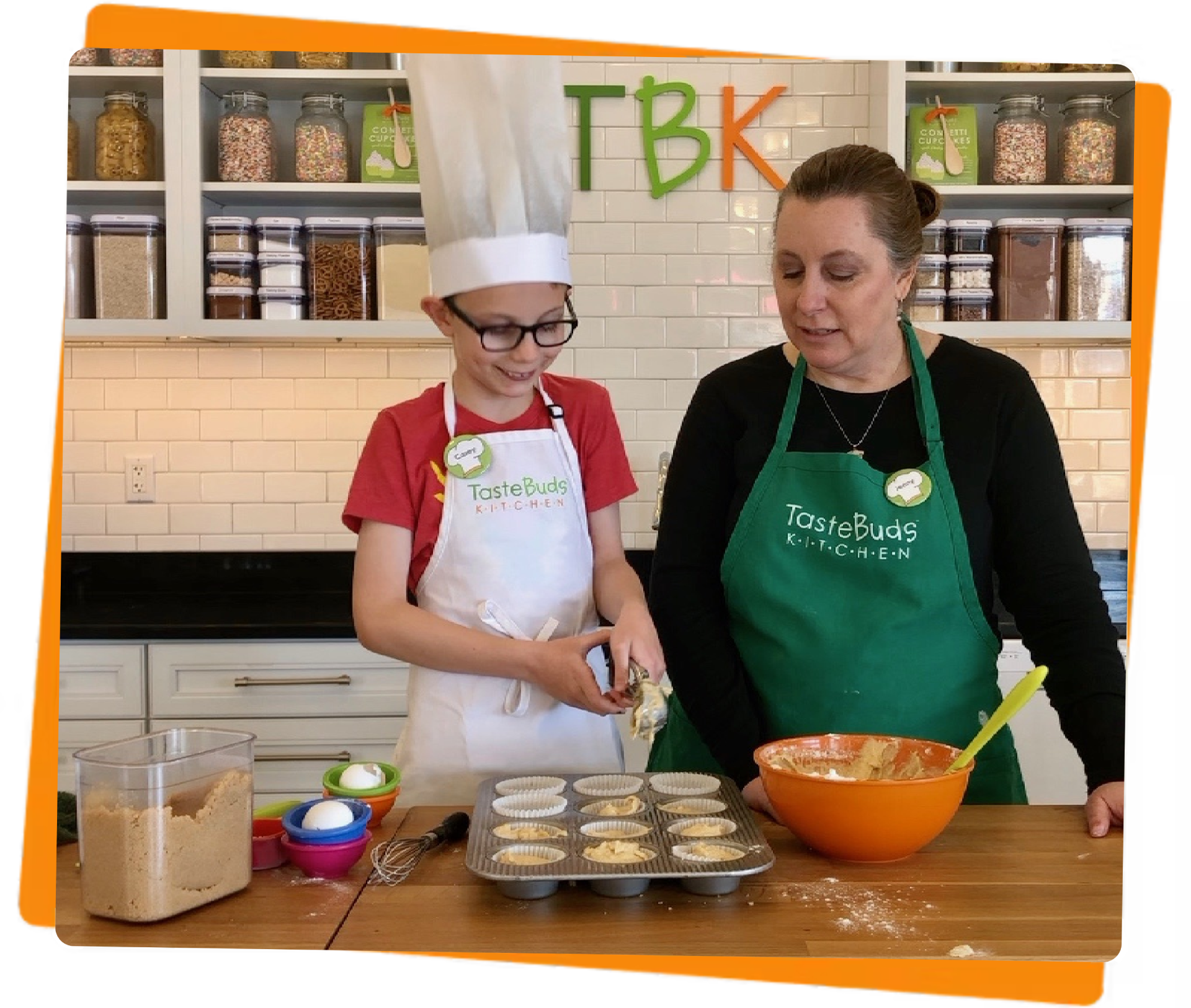 Women and boy making muffins