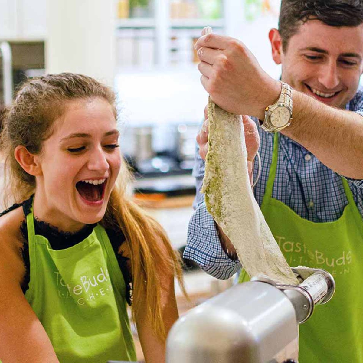 man and a woman making pasta from scratch