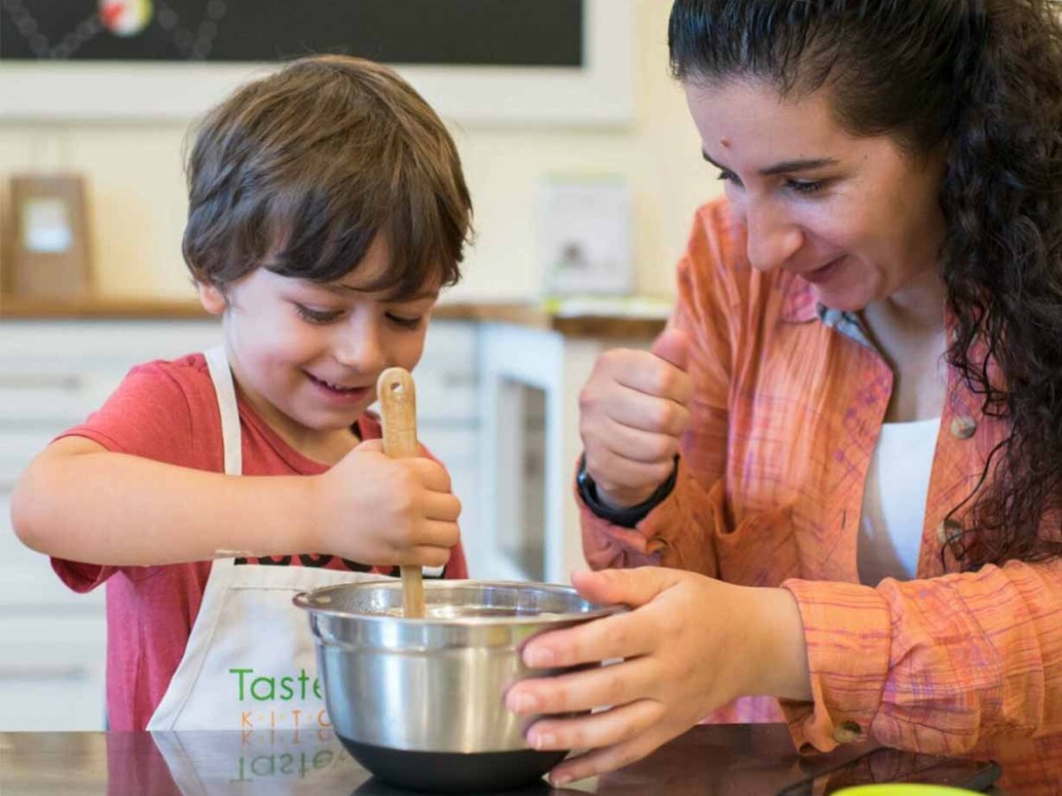 two people mixing ingredients