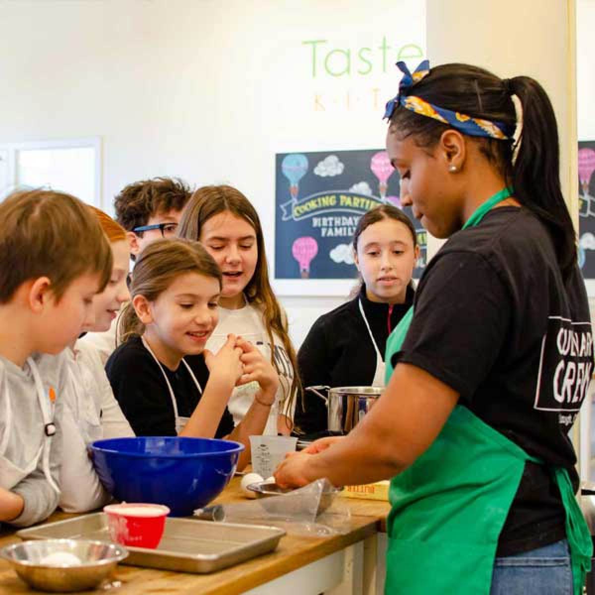 Female Chef with kids cooking camp class