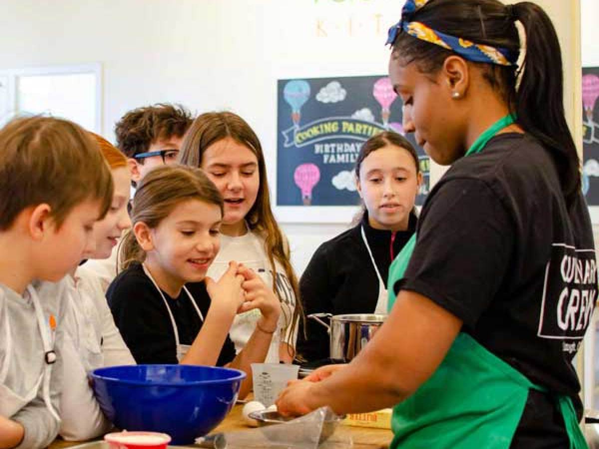 Female Chef with kids cooking camp class